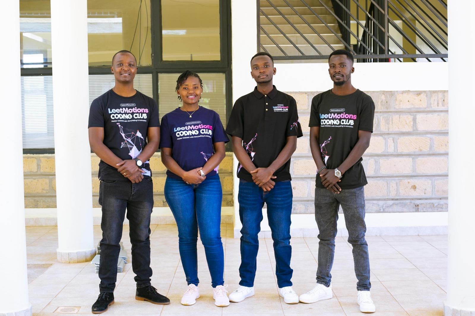 The LeetMotions instructors standing together in LeetMotions T-shirts
