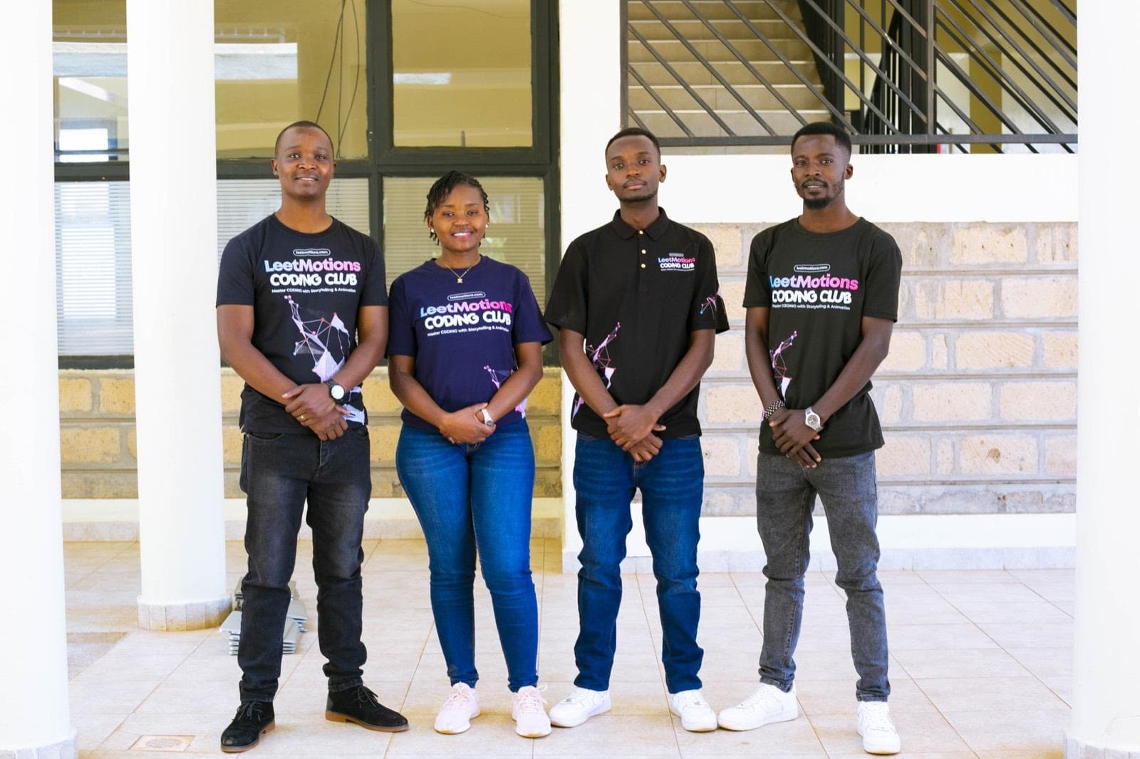 The four LeetMotions instructors standing together in LeetMotions T-shirts